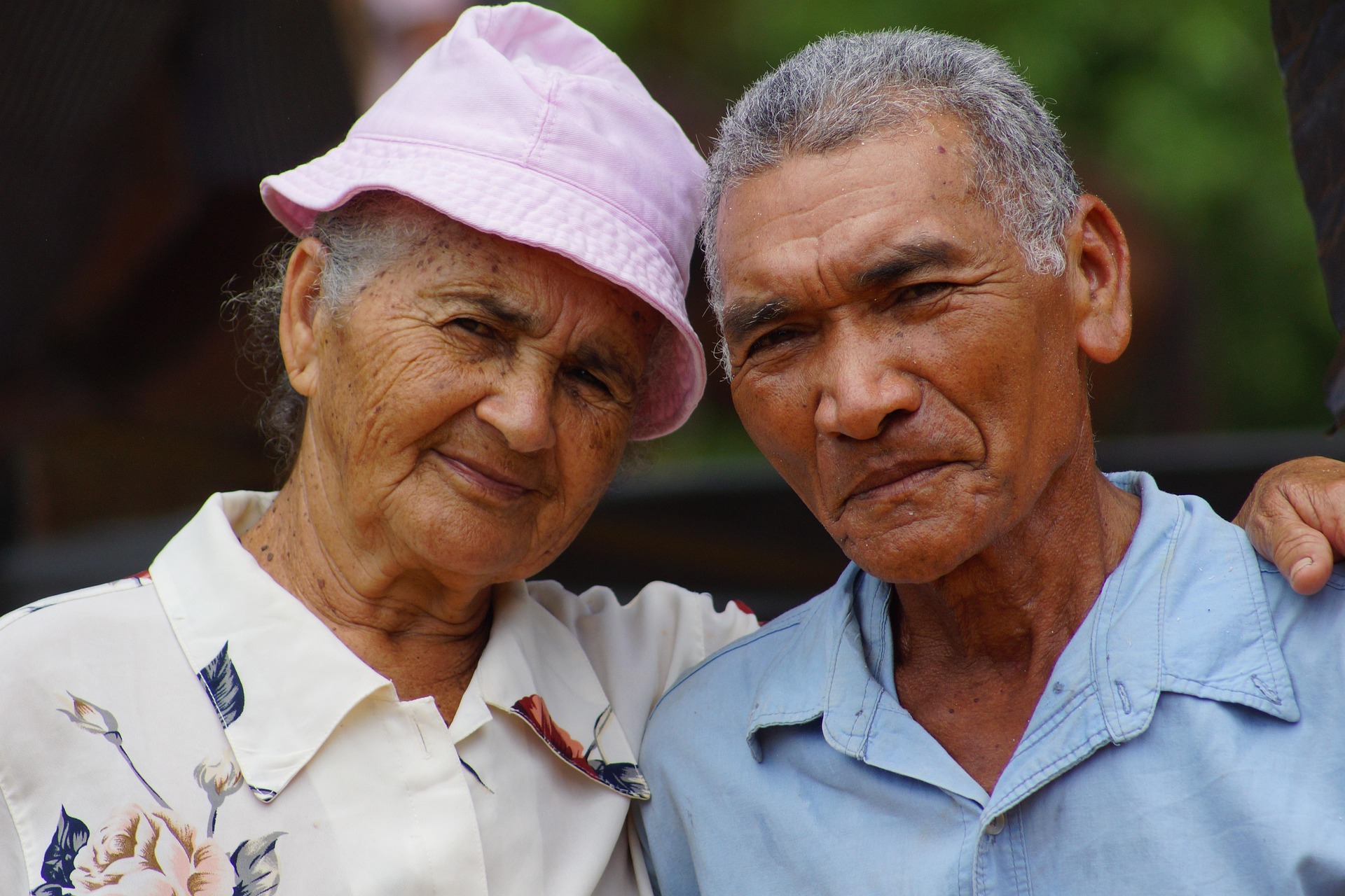 A retired couple reviewing Medicare documents at home